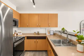 Stainless steel appliances, brand new microwave, and sleek finishes. Motion-activated faucet