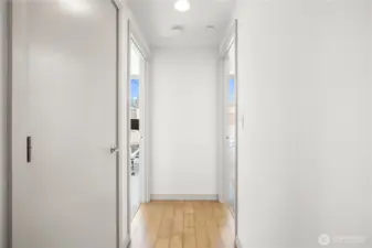 downstairs hallway leading to 2 BRs