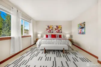 A very large Primary Bedroom takes up the whole west side of the home.