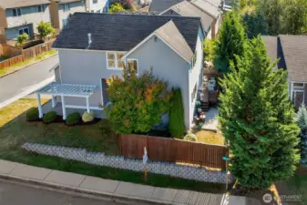 Fully fence back yard has the convenience of gates on both sides of the home.