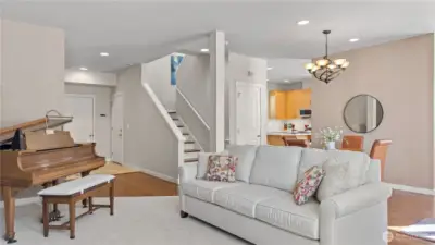 Main floor Formal Living Room and Dining Room. Including a Family Room (not shown) behind the Dining room wall.  Also showing the Garage Door and Entry Door.