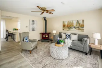 Living room with gas fireplace and lots of natural light.