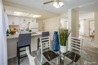 Dining area and breakfast bar adjacent to the kitchen.