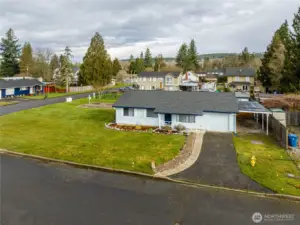 Notice the covered carport next to the garage.  No need to scrape frost off your car.  2 covered spaces...1 garage, 1 carport.
