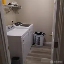 Laundry room with door to the garage.  Washer/Dryer stay