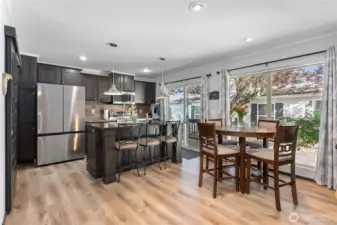 Open concept kitchen/dining/living