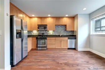 Another view of large kitchen with natural light.