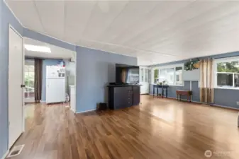The home has an attractive double door from the carport entrance which can be seen to the left of this photo. Look at those beautiful laminate floors!