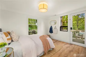 Second lower level bedroom.  Also has access to the back deck that wraps around the home