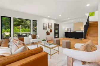 Viewpoint from the dining room to the front door stairs to the right go up to the primary suite