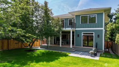 Amazing huge backyard is level, fully fenced, grassy and connected directly to the living room and kitchen.