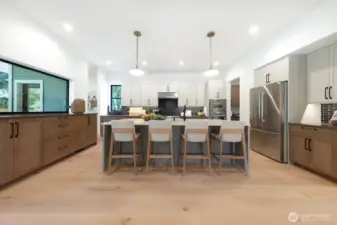 Great kitchen is the heart of the home. Open to both the living and outside. Notice the very cool pass through window to the left, and butlers pantry to the right.