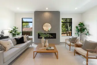 Living space is anchored by a dramatic fireplace flanked by windows; great natural light, perfect for every season.