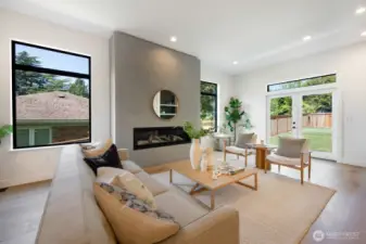 Epic huge level grassy and fenced backyard, directly off the kitchen and main floor living room.