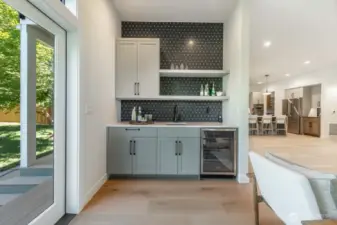 Frosty drinks are yours on a summer day; imagine BBQs and croquet in this great backyard.