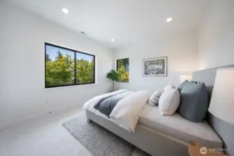 2/4 bedrooms on the top floor; check out all of the greenery out the window.