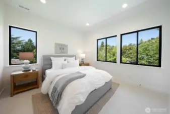 3/4 bedrooms on the top floor; check out all of the greenery out the window.