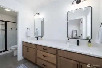 Primary ensuite has double sinks and a separate room for the tile shower.