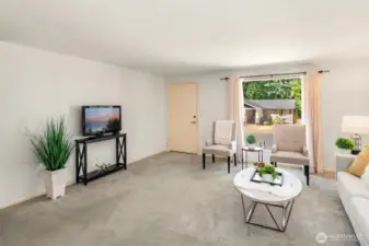 Picture window in living room casts plenty of natural lighting.