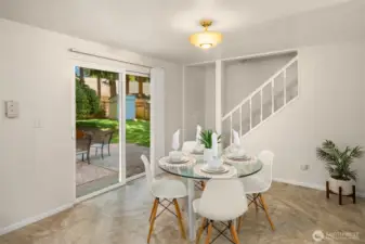 Slider out to fully enclosed backyard. Stairs lead to bonus room.