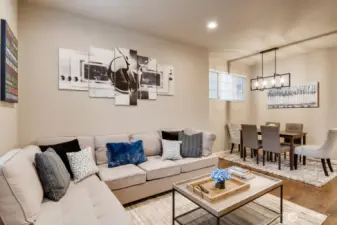Another view of the living room flowing seamlessly into the dining space.