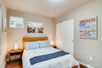 Third bedroom on the first floor with closet space and versatile use options.