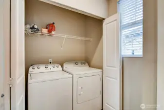 Laundry nook on the second floor for convenience and easy access.