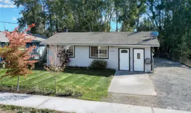 View from street. home has nice size yard. With RV parking, additional vehicles and toys.