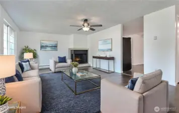 Living room is spacious, airy and room for gatherings. Virtually staged.