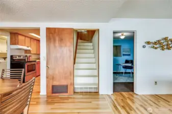 With the view to your back, stairs that lead to the 2nd level.  To the right is the bedroom on the main.