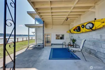 Wonderful covered patio on water side.  Apartment/additional living space straight ahead.