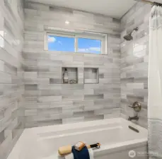 Separate bathtub room in bedroom level bath.