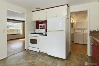 Entry to the utility room with a half bath.