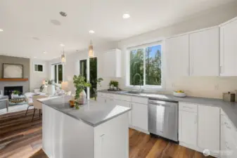 Stainless steel appliances, a French door refrigerator, wall oven, separate cooktop, and a crisp white tile backsplash