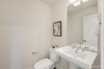A convenient powder room completes the main level