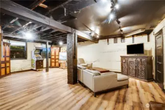 Basement lower level is partially finished with new laminate flooring making this space warm and industrial.  It offers separate entrance for multi-generational living.