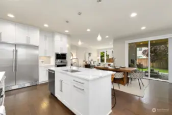 Another view of kitchen overlooking dining and living space.