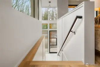 Subtle lighting under the handrail enhances your entry to the main living area.