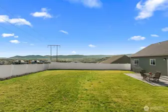 Back yard views to the South showing plenty of room for play or even that pool you were thinking about.