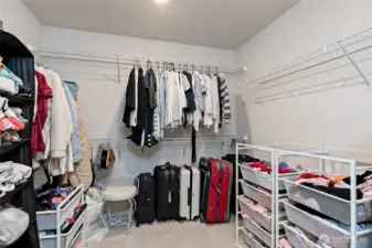 Huge primary closet, lots of storage behind door too