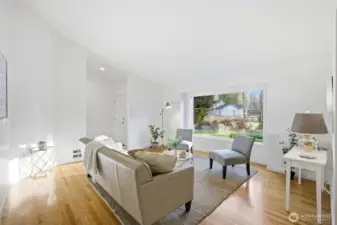 Light filled front room with oversized picture window!