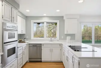 Light-filled kitchen with an open layout and quartz counters