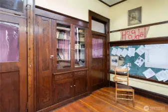 Built in storage and book cases. One of the drawers is autographed by original builder!