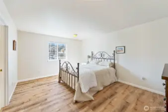Primary bedroom with connected bathroom and walk in closet
