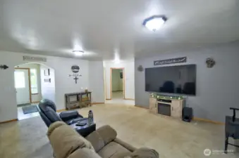 Great room looking toward the entry and hallway to bedrooms.