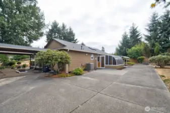 Driveway extends to the back of the house for added parking and convenience.