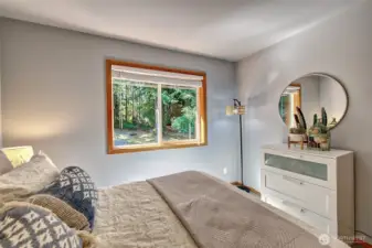 Guest bedroom 1 has a lovely view of the back yard.
