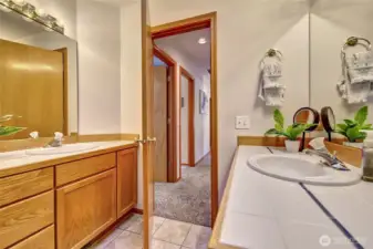 Two separate vanities in the guest bathroom! Great for storage!