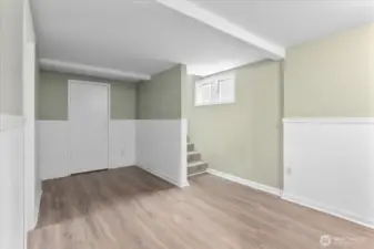 Lower level with living space, 2 bedrooms, bathroom and utility room.