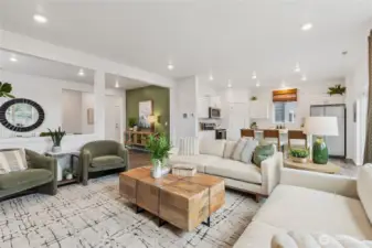 Large great room with plenty of seating space. Actual home is under construction and finishes, colors, and materials may vary. See site agent for details.